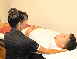 Orleans Physiotherapist applying craniosacral therapy treatment